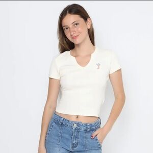 iHollister white cropped t-shirt with a embroidered cowboy boot design